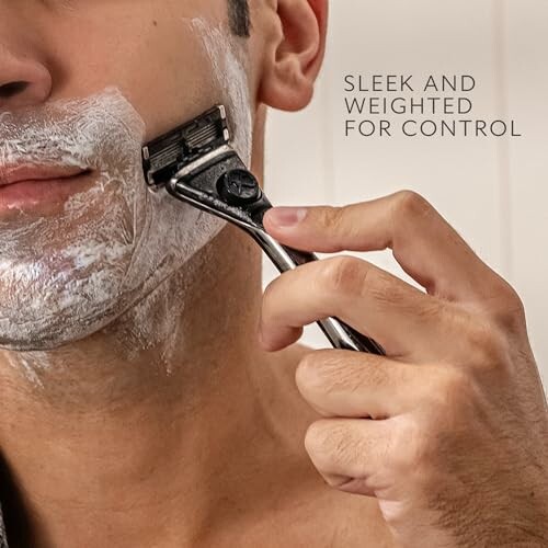 Man shaving with a razor, close-up